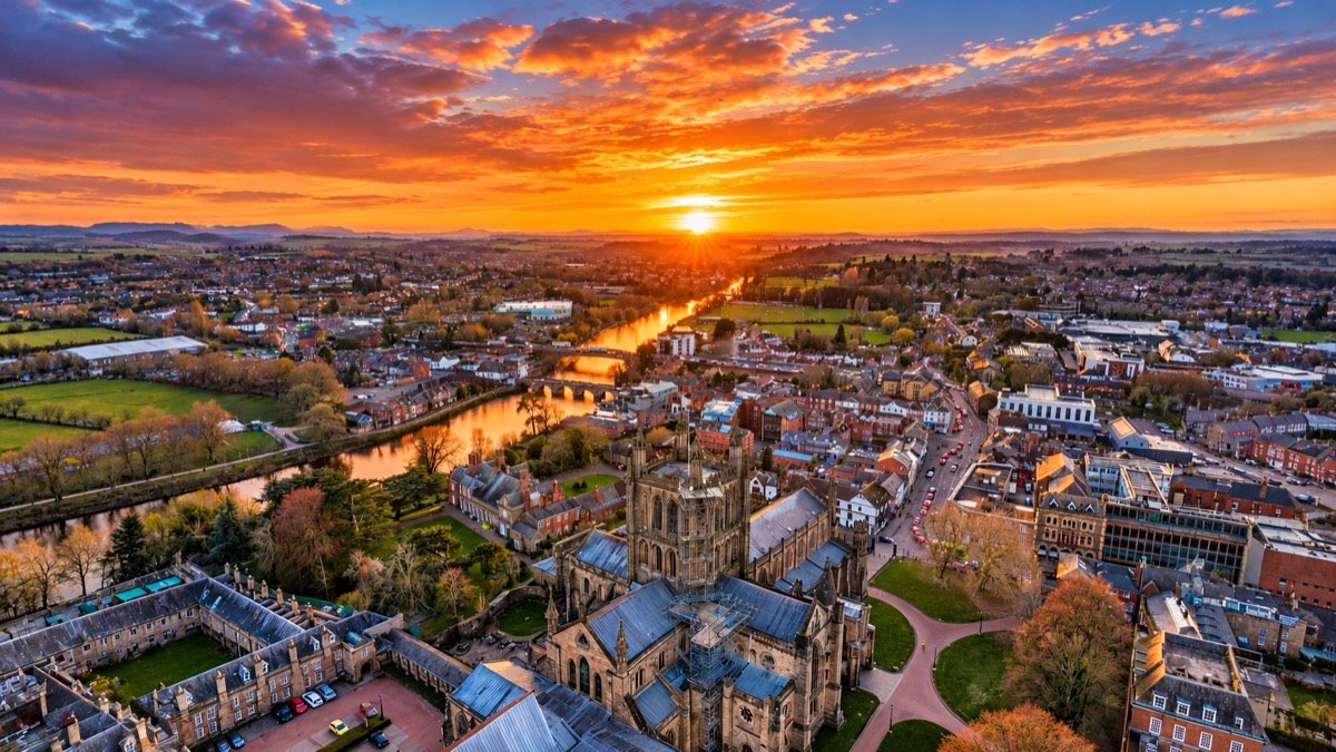 Aerial view of Hereford Cathedral and the River Wye at sunset